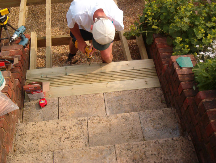Fitting pre-treated decking boards - Allow shrinkage, stagger joints